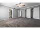 Carpeted main bedroom with large closet and bathroom view at 6240 N 16Th St # 40, Phoenix, AZ 85016