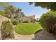 Large, lush backyard with a well-maintained lawn provides ample space for recreation and outdoor enjoyment at 6828 E Evans Dr, Scottsdale, AZ 85254