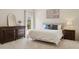 Bright bedroom features a tufted headboard, neutral decor, dresser and plenty of natural light at 6828 E Evans Dr, Scottsdale, AZ 85254
