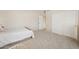 Spacious, carpeted bedroom featuring a walk-in closet, ceiling fan, and ensuite access offers plenty of space at 6828 E Evans Dr, Scottsdale, AZ 85254