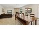 Open living space with stone fireplace, tile flooring, and large windows offering outdoor views at 6828 E Evans Dr, Scottsdale, AZ 85254