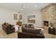 Cozy living room features stone fireplace, ceiling fan and mount for TV viewing at 6828 E Evans Dr, Scottsdale, AZ 85254