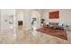 Bright, open-concept living room with tile floors, neutral walls, and a comfortable seating area at 6828 E Evans Dr, Scottsdale, AZ 85254