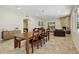 Inviting space with dining and living area. A stone fireplace and mounted TV completes the room at 6828 E Evans Dr, Scottsdale, AZ 85254