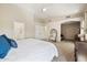 Spacious bedroom boasts vaulted ceilings, an arched doorway and a peek into the ensuite bathroom at 6828 E Evans Dr, Scottsdale, AZ 85254