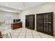 Bright office space with a large desk, built-in cabinets, and a comfortable seating area at 6828 E Evans Dr, Scottsdale, AZ 85254