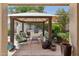 Outdoor kitchen area featuring built-in grill, fireplace, and comfortable seating for entertaining at 6828 E Evans Dr, Scottsdale, AZ 85254