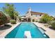 Inviting pool featuring diving board and a tanning shelf in a private backyard oasis at 6828 E Evans Dr, Scottsdale, AZ 85254