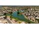 An aerial view of a neighborhood with a beautiful lake and lush landscaping at 7053 S Heather Dr, Tempe, AZ 85283