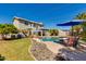 Inviting backyard featuring a sparkling pool, patio area, and lush landscaping under a blue sky at 7053 S Heather Dr, Tempe, AZ 85283