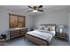 Cozy bedroom features a ceiling fan, neutral color palette and plenty of natural light at 7053 S Heather Dr, Tempe, AZ 85283