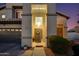 Inviting home exterior with a well-lit entrance and manicured landscaping, featuring a welcoming front door at 7053 S Heather Dr, Tempe, AZ 85283