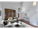 Bright living room features a vaulted ceiling, shutters, modern decor, and sleek, contemporary furnishings at 7053 S Heather Dr, Tempe, AZ 85283