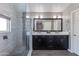 Main bathroom featuring double sinks, modern vanities, and an enclosed glass shower at 7053 S Heather Dr, Tempe, AZ 85283