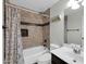 Updated bathroom with tiled shower/tub combo, modern vanity, and tiled niche at 706 E Washington St # 204, Phoenix, AZ 85034