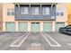 Modern condo garages with assigned parking in front of each at 706 E Washington St # 204, Phoenix, AZ 85034