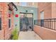 Inviting gated entryway with secured access to residential units above street level at 706 E Washington St # 204, Phoenix, AZ 85034