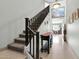 Bright hallway featuring tiled floors, staircase, and stylish décor leading to other rooms at 706 E Washington St # 204, Phoenix, AZ 85034