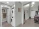 Hallway featuring tiled floors, stacked washer/dryer, and stylish décor at 706 E Washington St # 204, Phoenix, AZ 85034