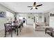 Open-concept living space features a dining area, sofa, and tile flooring throughout at 706 E Washington St # 204, Phoenix, AZ 85034