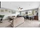 Bright, open-concept living and dining area, complete with neutral paint and tiled flooring at 706 E Washington St # 204, Phoenix, AZ 85034