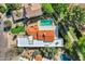 Aerial view of a home with a terracotta tile roof, a private pool, and lush landscaping in a vibrant community at 7168 N Via De Amigos --, Scottsdale, AZ 85258