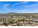 Scenic aerial view showcasing the neighborhood's layout, architecture, and the picturesque mountain range in the background at 7168 N Via De Amigos --, Scottsdale, AZ 85258