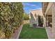 A well-maintained backyard featuring lush greenery and privacy bushes, creating a secluded and inviting outdoor space at 7168 N Via De Amigos --, Scottsdale, AZ 85258