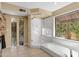 Bright bathroom featuring soaking tub, glass enclosed shower, and natural light at 7168 N Via De Amigos --, Scottsdale, AZ 85258