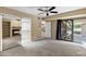 Spacious carpeted bedroom with closet, fireplace, and patio access at 7168 N Via De Amigos --, Scottsdale, AZ 85258