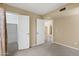 Bedroom with neutral walls and carpeting plus entry to walk-in closet and hall at 7168 N Via De Amigos --, Scottsdale, AZ 85258