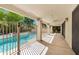 Spacious covered patio with a ceiling fan overlooking a sparkling pool and lush backyard at 7168 N Via De Amigos --, Scottsdale, AZ 85258