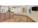 Bright eat-in kitchen with tile floors, island, and stainless steel vent hood at 7168 N Via De Amigos --, Scottsdale, AZ 85258