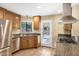 Well-equipped kitchen with stainless steel appliances, granite countertops, and tile floors at 7168 N Via De Amigos --, Scottsdale, AZ 85258