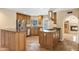 Updated kitchen with granite countertops, stainless steel appliances, and an island at 7168 N Via De Amigos --, Scottsdale, AZ 85258