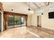 Bright living room with large windows, ceiling fan and tiled flooring at 7168 N Via De Amigos --, Scottsdale, AZ 85258