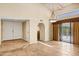 Bright and airy living room featuring high ceilings, tile floors, and sliding glass doors to the outdoor area at 7168 N Via De Amigos --, Scottsdale, AZ 85258