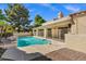 Backyard swimming pool surrounded by mature trees, covered patio, and an extended deck at 7168 N Via De Amigos --, Scottsdale, AZ 85258
