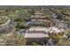 Aerial shot of the home showing the pool, desert landscaping and close proximity to the golf course at 7322 E High Point Dr, Scottsdale, AZ 85266