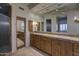 Elegant bathroom featuring a double sink vanity, and a step-in shower at 7322 E High Point Dr, Scottsdale, AZ 85266