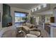 Inviting living room with a unique fireplace, comfortable seating, and bright natural light at 7322 E High Point Dr, Scottsdale, AZ 85266
