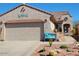 Charming single-story home with desert landscaping, a two-car garage, and a cozy entryway at 8205 S Pioneer Ct, Gold Canyon, AZ 85118