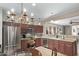 Well-equipped kitchen with stainless steel appliances and breakfast bar at 8205 S Pioneer Ct, Gold Canyon, AZ 85118