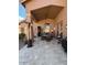 Inviting covered patio with travertine flooring, perfect for outdoor dining and relaxation at 9706 E Sheena Dr, Scottsdale, AZ 85260