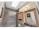 Bathroom features glass enclosed shower, granite counters, and skylight at 9706 E Sheena Dr, Scottsdale, AZ 85260