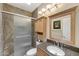 Bathroom features glass enclosed shower, granite counters, and skylight at 9706 E Sheena Dr, Scottsdale, AZ 85260