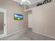Neutral bedroom features ceiling fan, vaulted ceiling, and a flat screen television at 9706 E Sheena Dr, Scottsdale, AZ 85260