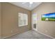 Bedroom featuring ceiling fan, large window, and a flat screen television at 9706 E Sheena Dr, Scottsdale, AZ 85260