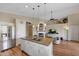 Bright, open kitchen with an island, stainless steel appliances, and beautiful wood floors at 9706 E Sheena Dr, Scottsdale, AZ 85260