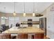 Modern kitchen featuring stainless steel appliances, granite countertops, and an island at 9706 E Sheena Dr, Scottsdale, AZ 85260